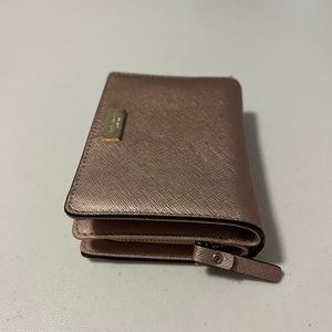Compact rose-gold wallet from kate spade